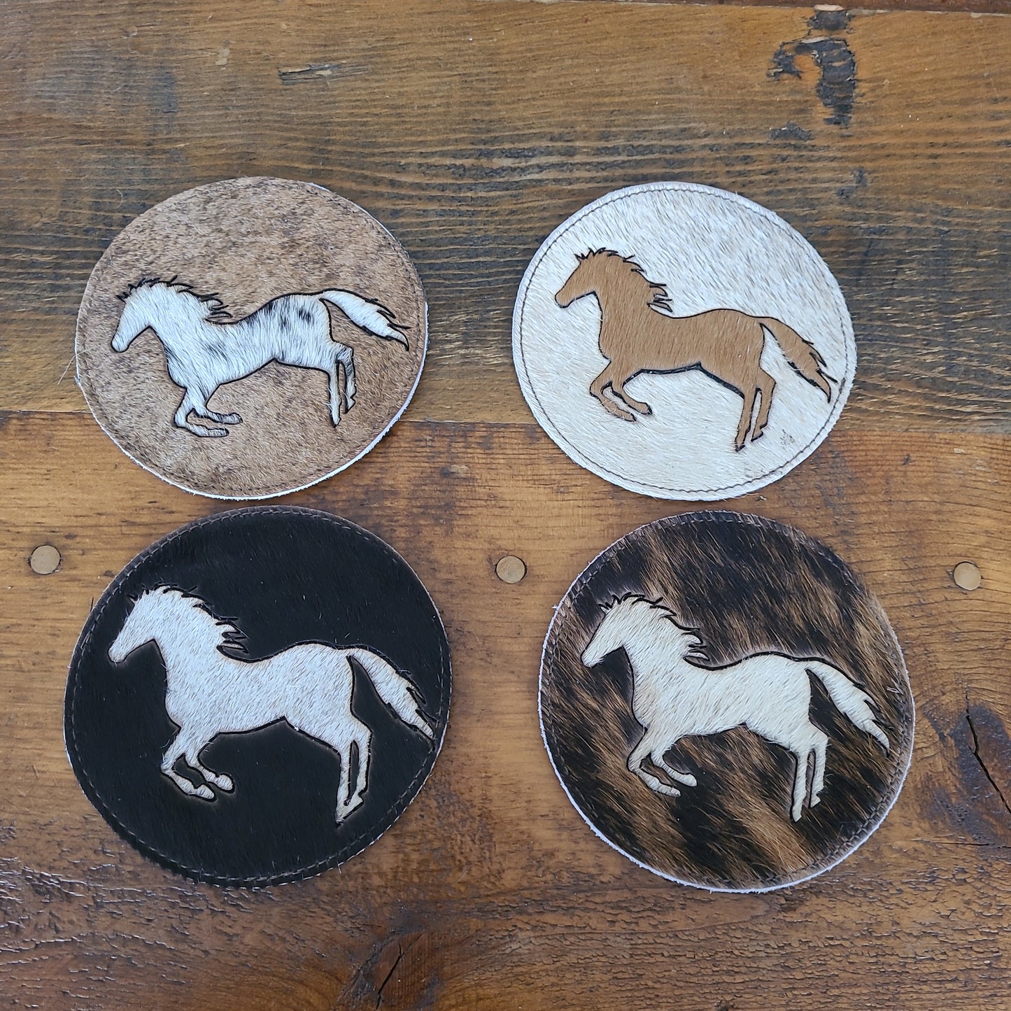 Gift Home Furnishings Cowhide Coaster With Horse cutout.