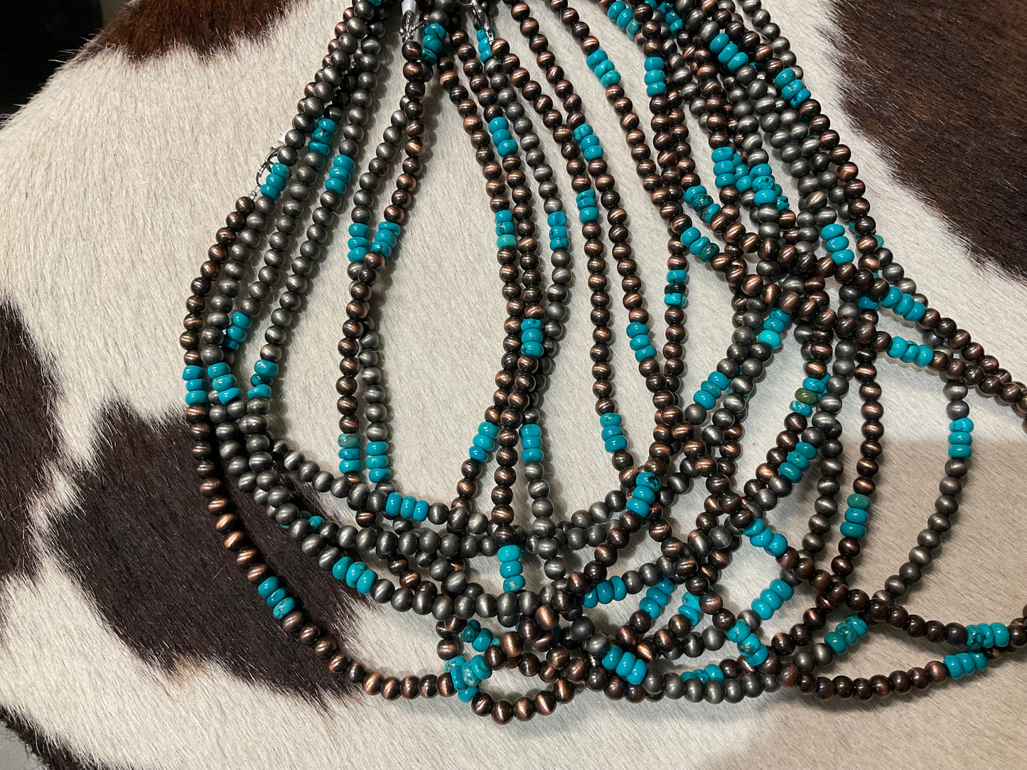Necklaces turquoise and silver colored beads