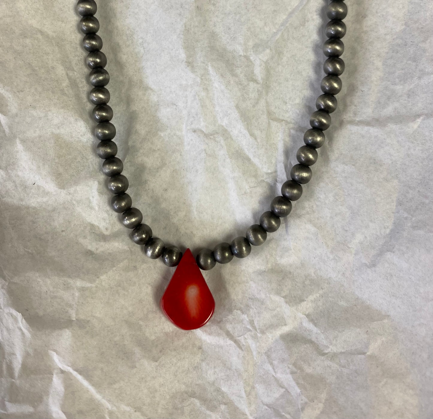 Choker necklace, turquoise and brown stone with concho accent.
