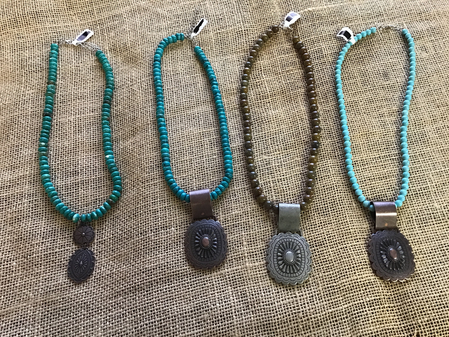 Choker necklace, turquoise and brown stone with concho accent.