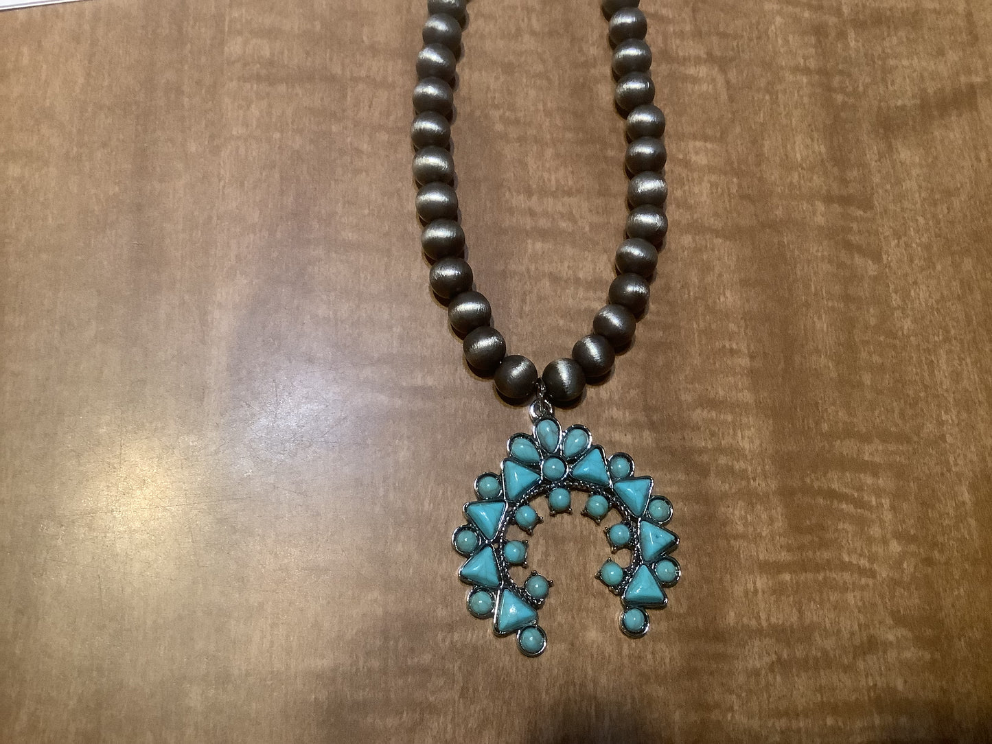 Globe bead necklace in bronze and silver