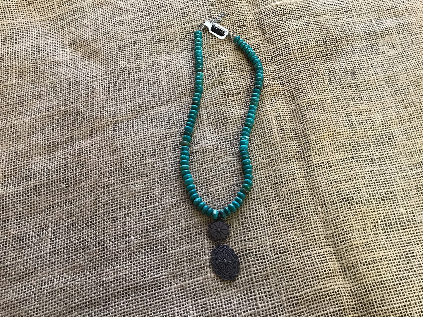 Choker necklace, turquoise and brown stone with concho accent.