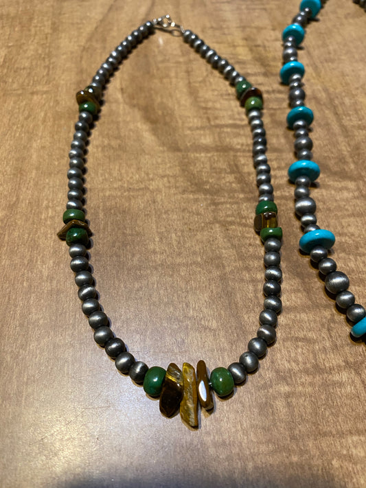 Necklaces turquoise and silver colored beads