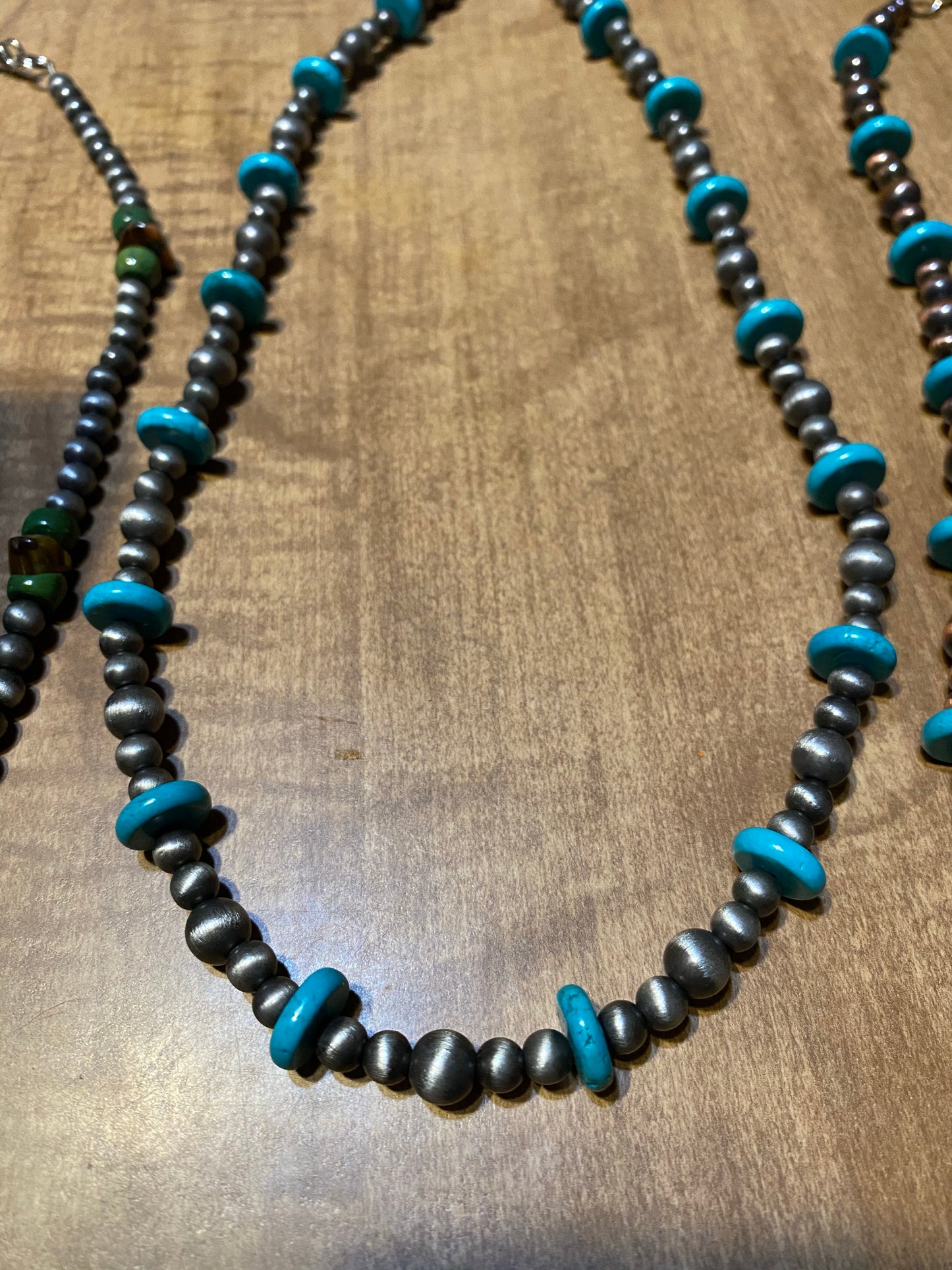 Necklaces turquoise and silver colored beads
