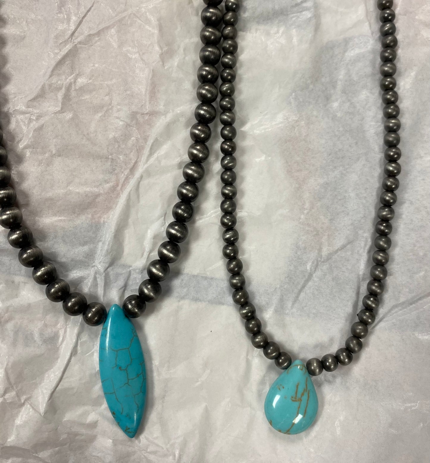 Choker necklace, turquoise and brown stone with concho accent.