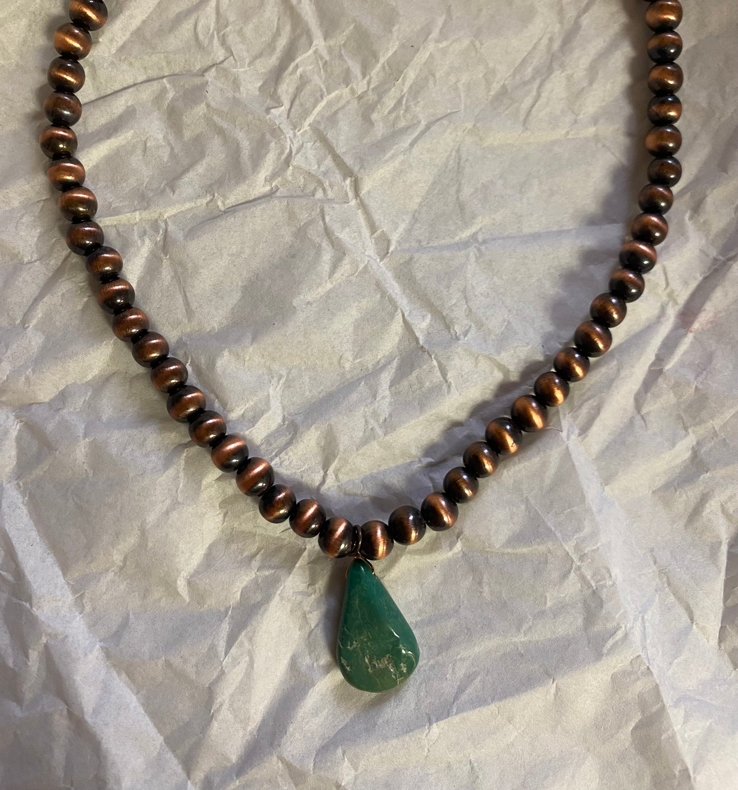 Choker necklace, turquoise and brown stone with concho accent.
