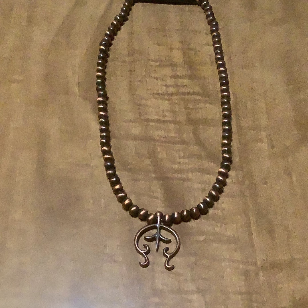 Choker necklace, turquoise and brown stone with concho accent.