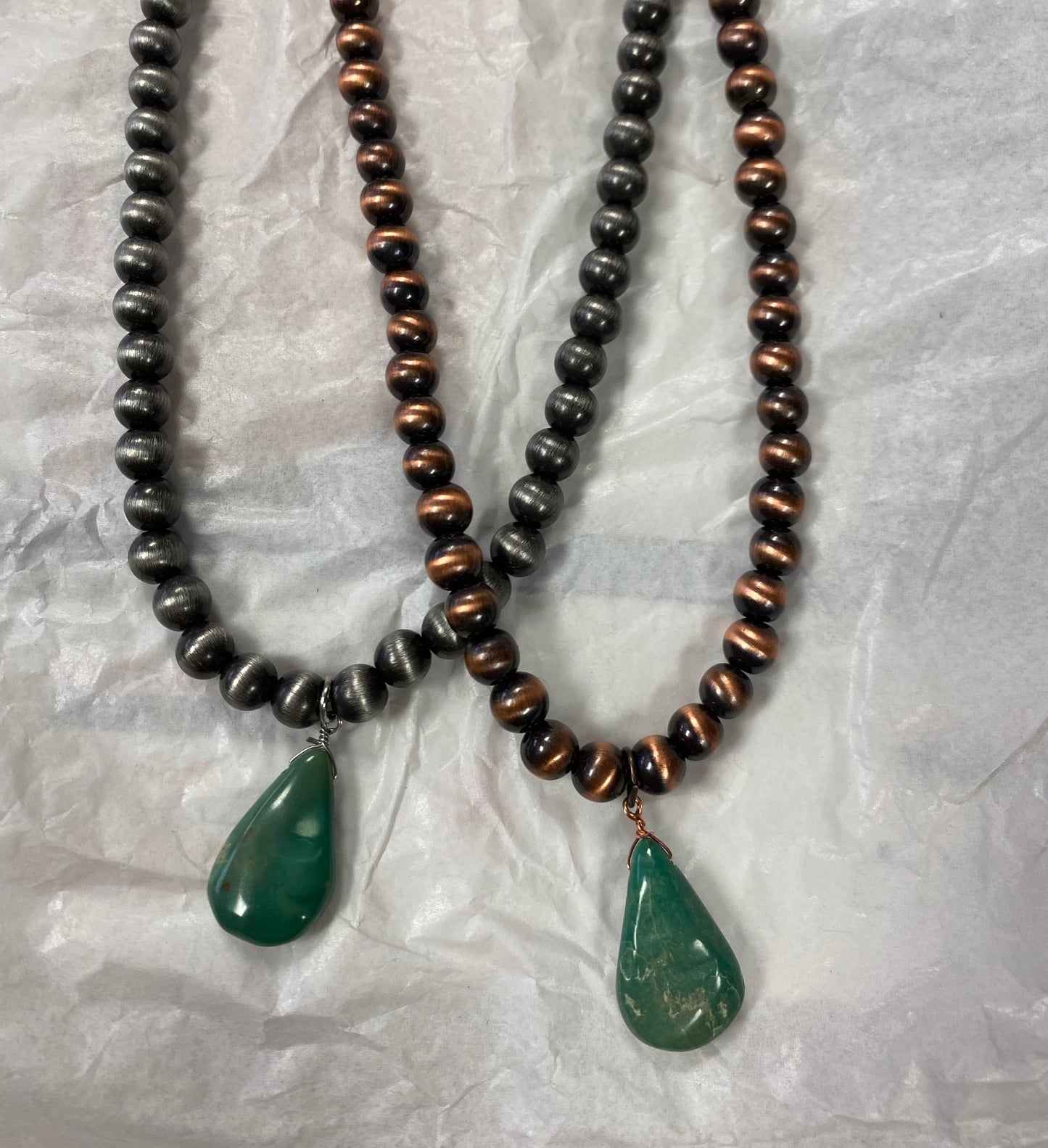Choker necklace, turquoise and brown stone with concho accent.