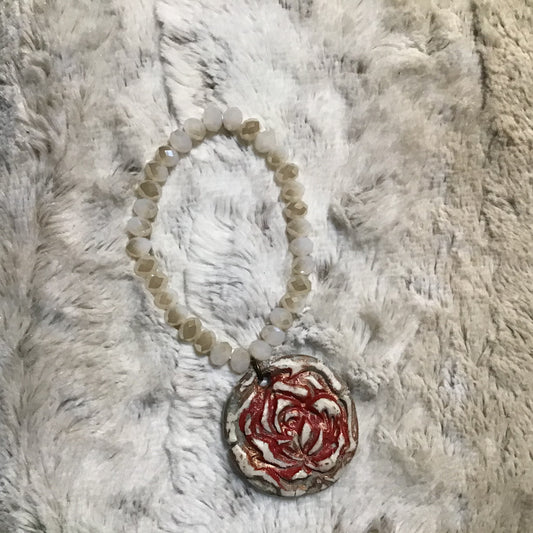 Handmade bracelet with rose disk on sparkling beads