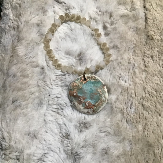 Handmade bracelet with rose disk on sparkling beads