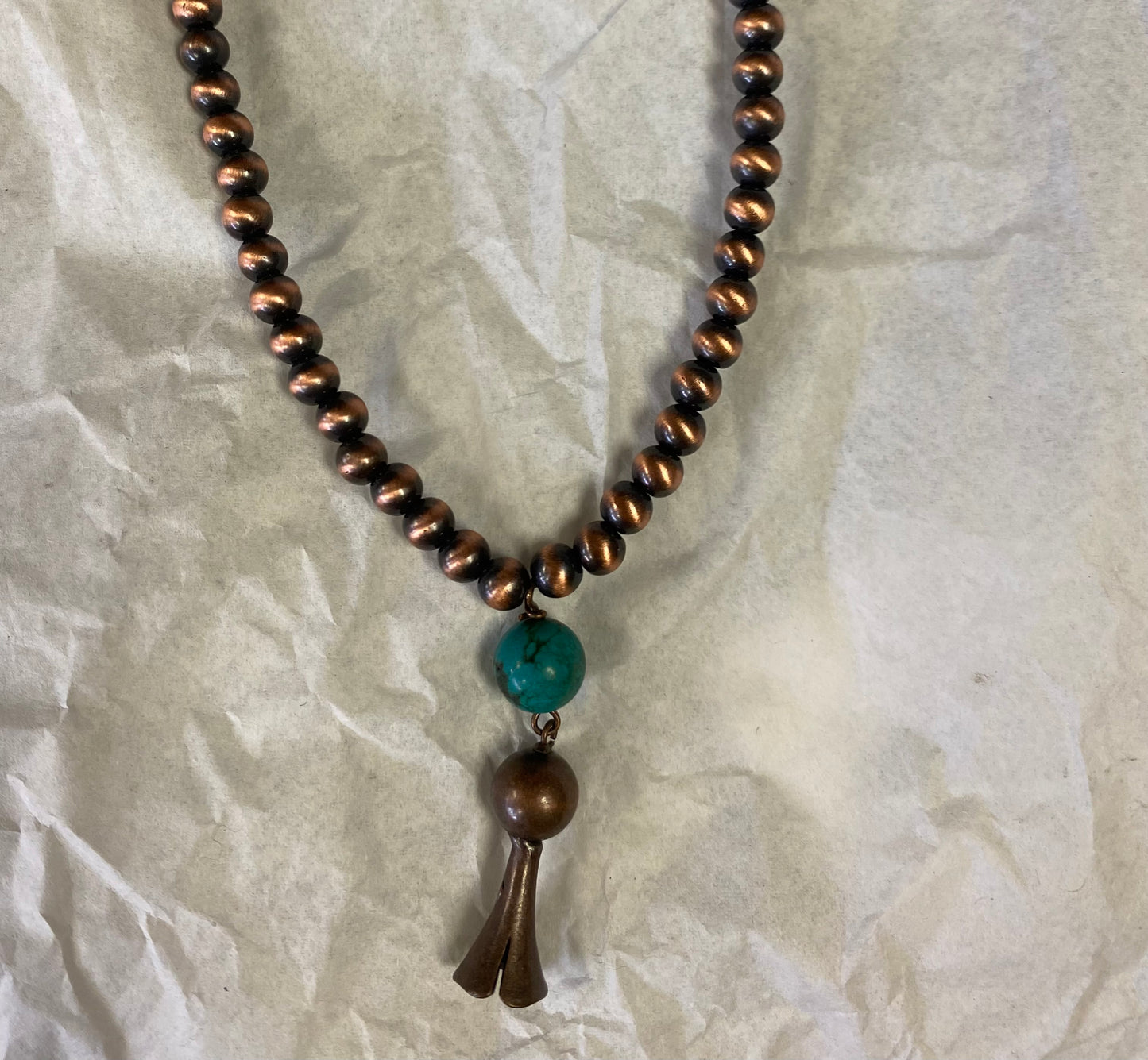 Choker necklace, turquoise and brown stone with concho accent.